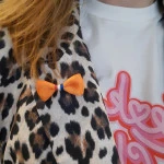 Oranje strikken met Speld | www.pietkoopmans.nl